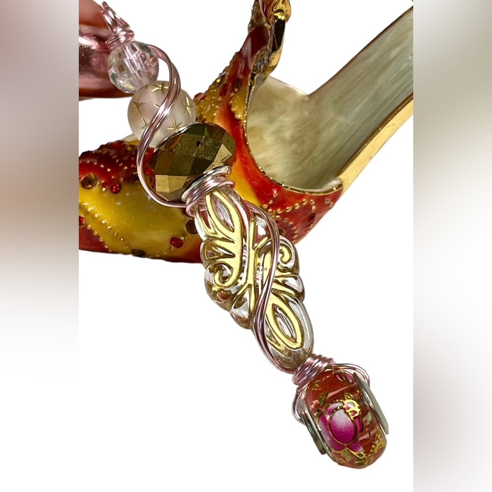 Pink and silver with gold Pandora like bead made into a unique wrapped pendant
